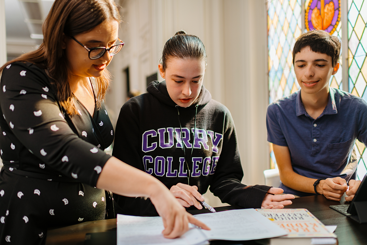 Students work with a PAL faculty member in the AT Center