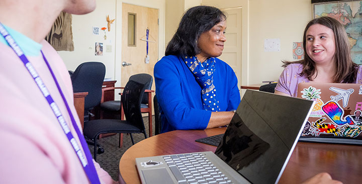 A student in the Program for Advancement of Learning (PAL) meets with her professor