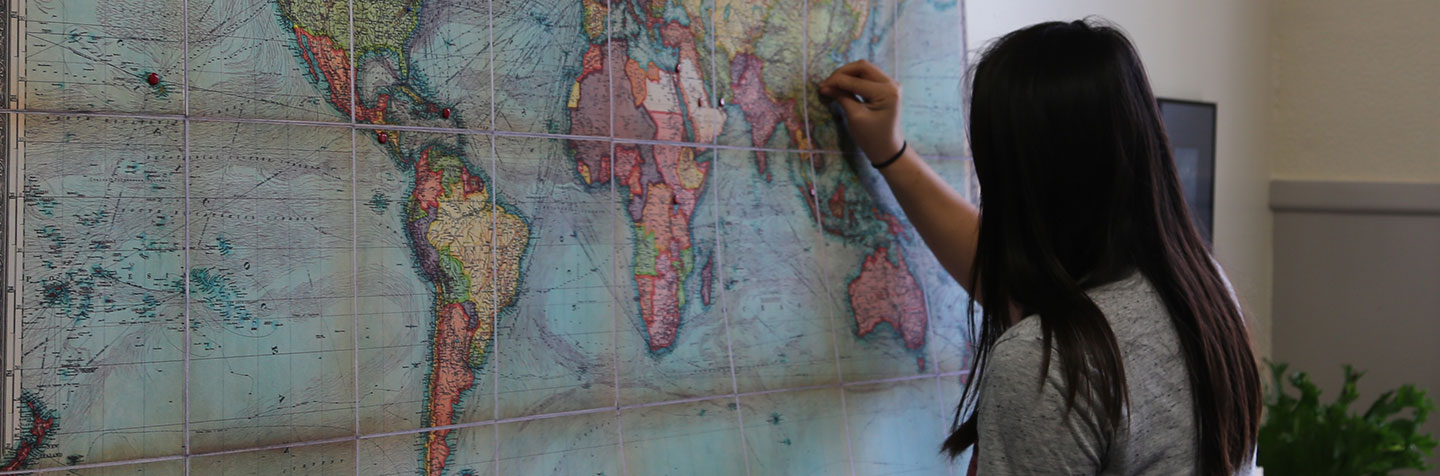 A PAL for Multilingual Student places a pin in a map