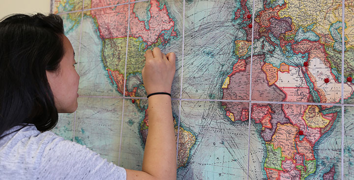 A PAL for Multilingual Student places a pin in a map