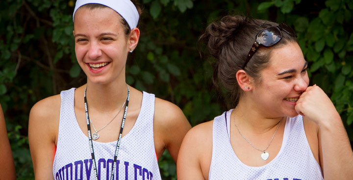 Curry College Summer PAL students laugh while doing an activity on campus