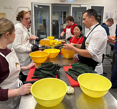 Curry College students cooking in Italy