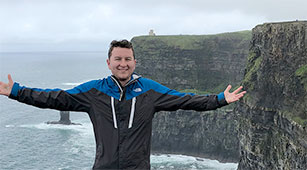 Curry College Students Studying abroad in London, pose in front of London Bridge