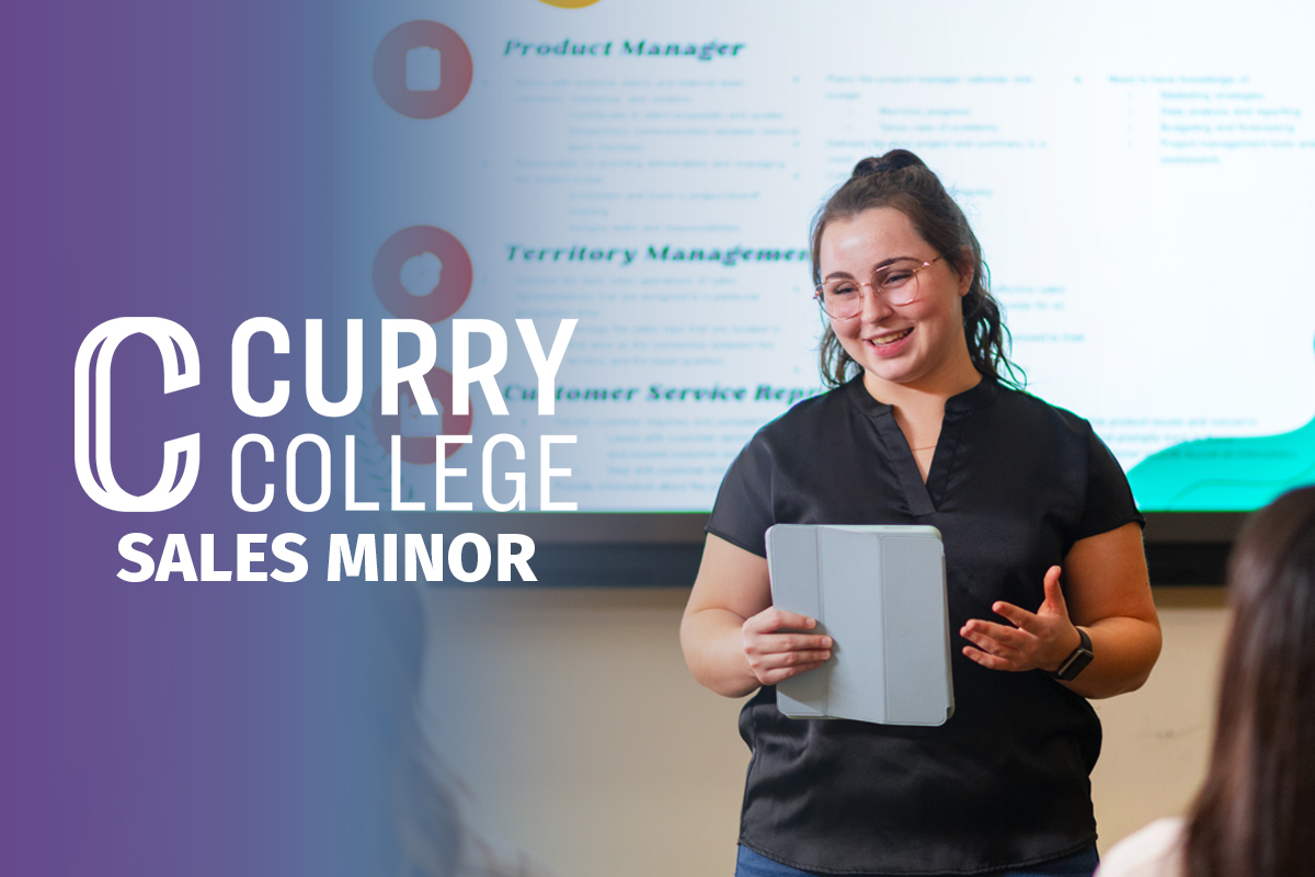 Sales Minor Video represented by a student presenting her business project in class with a touchpad
