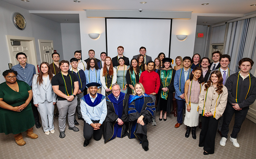 Sigma Beta Delta Inductees and Faculty pose for a photo at the 2026 induction ceremony