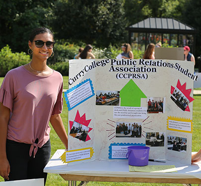 Curry College PRSA student poses for a photo