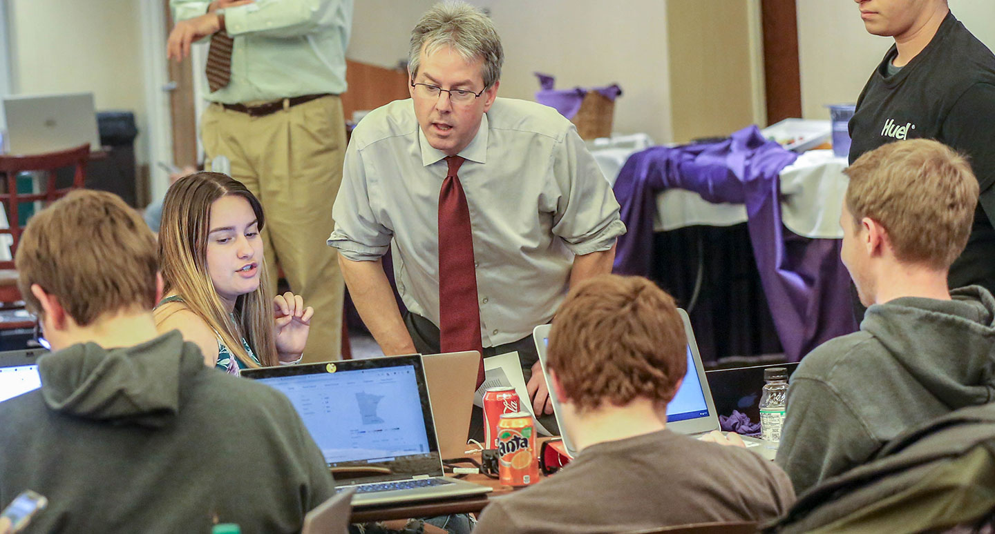 A student and faculty member collaborate in a law class