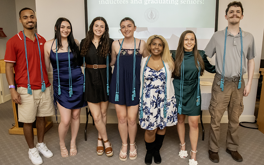 Students pursuing a Sociology degree at Curry College get inducted to the Sociology honor society