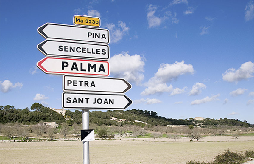 A street sign in Spain represents the Spanish Minor at Curry College