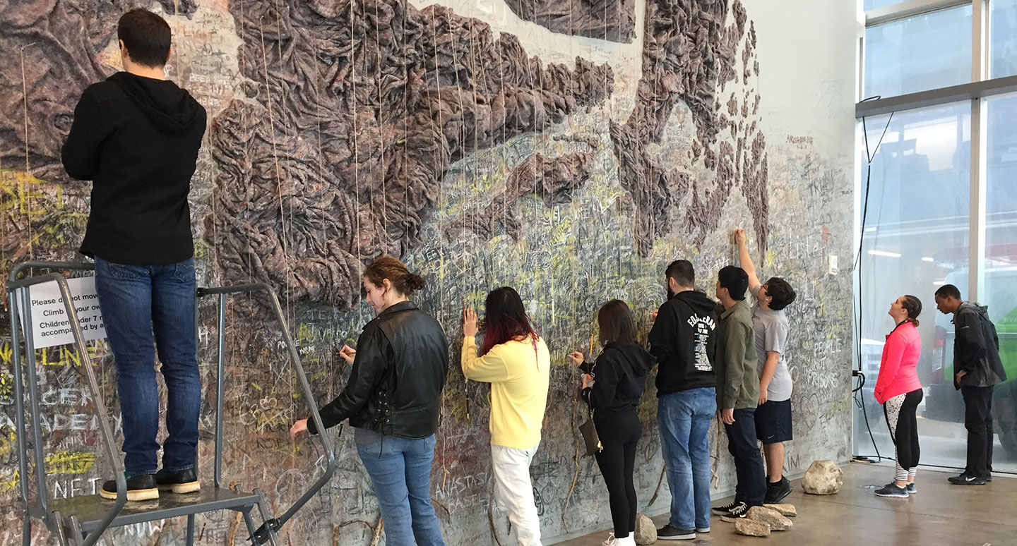 Students from the Fine and Applied Arts Seminar interact with artist Wangechi Mutu's installation at the Institute of Contemporary Art in Boston.