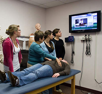 Curry Nursing students and faculty in the lab