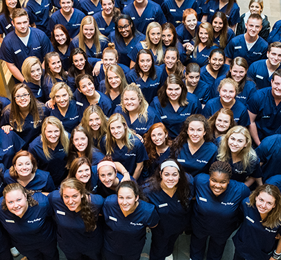 Curry Nursing students pose for a photo in the Katz Gym lobby
