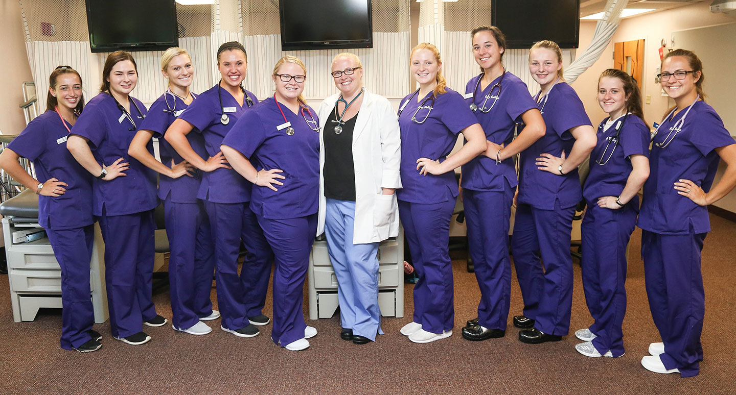 Curry College School of Nursing students in their Purple Scrubs