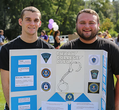 A Curry College Criminal Justice Student Organization students pose for a photo