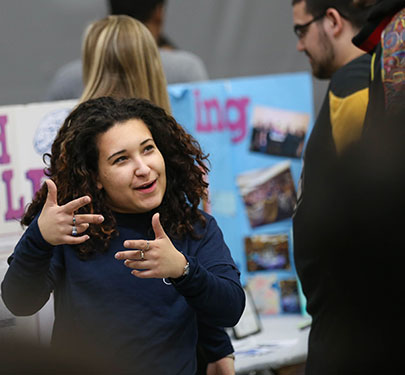 A Curry College W.E.B. DuBois Sociology Club member explains her club to fellow students