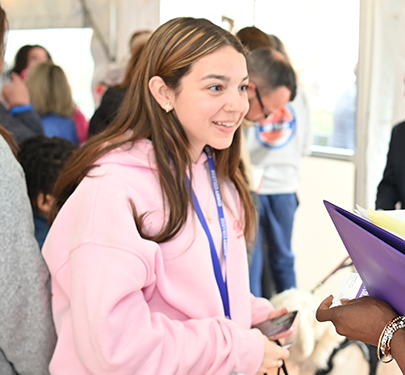 A student speaks with an admission counselor