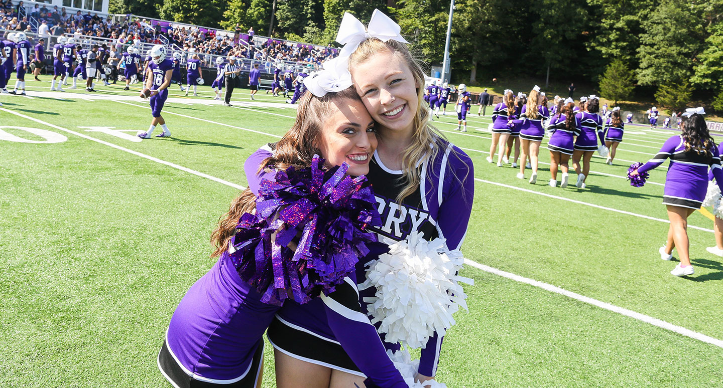 Cheerleaders at Curry College Homecoming and Family Weekend
