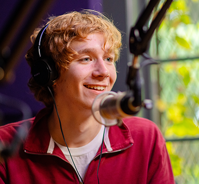 A radio student doing a show in the podcast studio