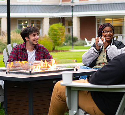 Students hang out near the firepits