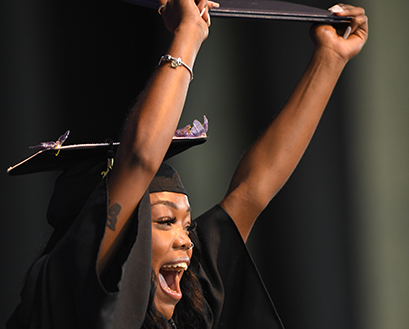 A Curry College student receives her diploma