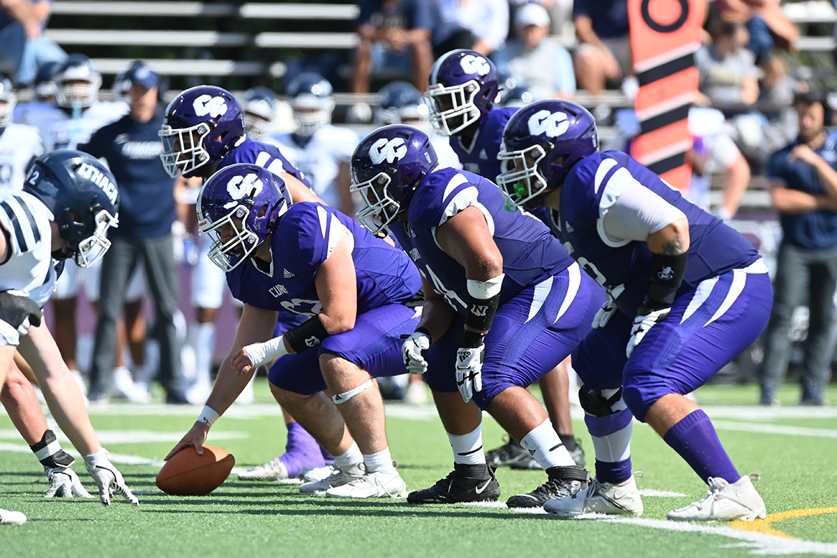Curry College football team lines up for a play