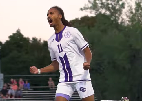 A men's soccer player celebrates a goal