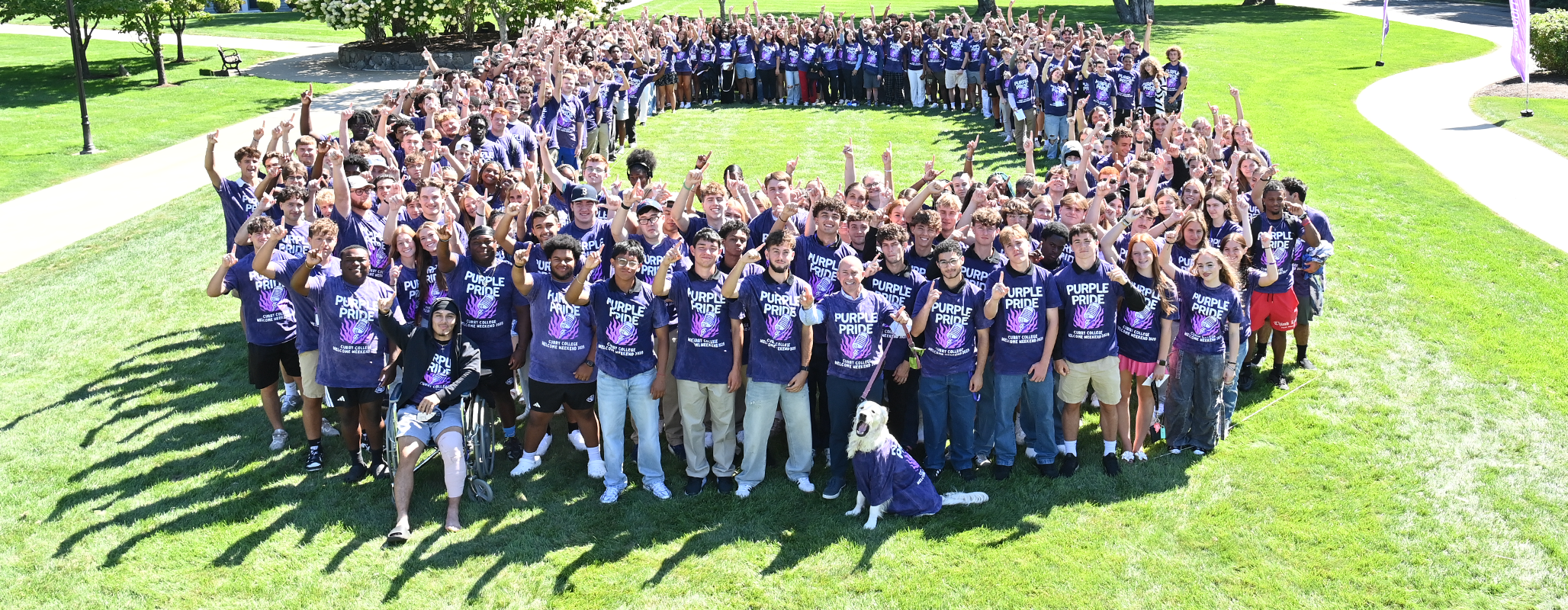 The Curry College Class of 2029 Photo with President Gonzalez and Graham