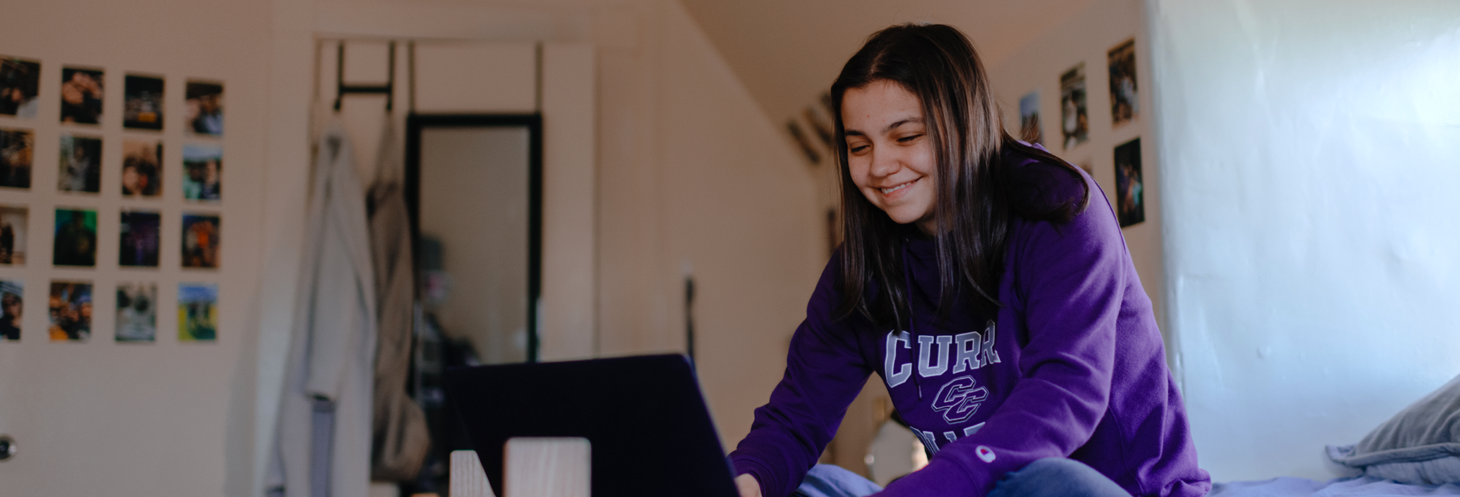 Maddy Greene '26 studies on her laptop in her residence hall