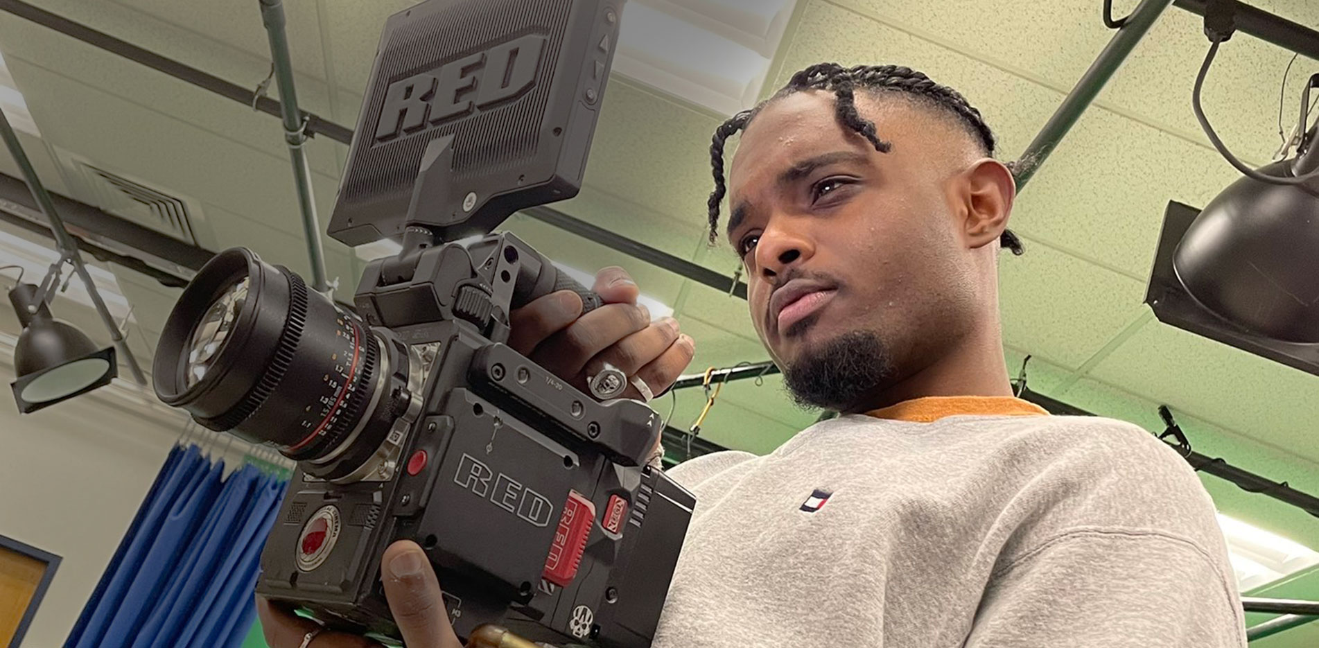 A communication student uses a RED Camera for film class