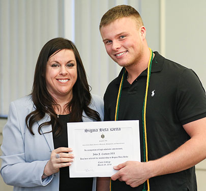 A Sigma Beta Delta member at the induction 