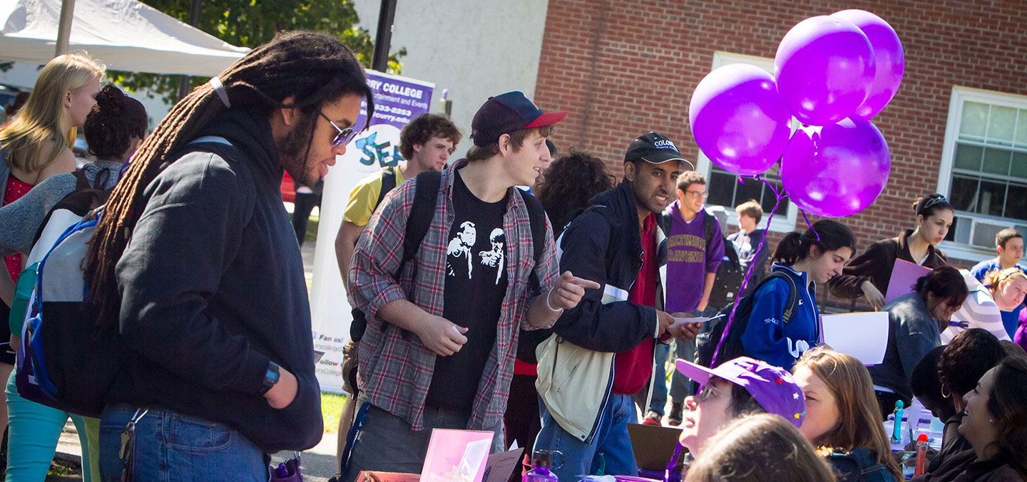 Curry students flock to different club tables at the Involvement Fair