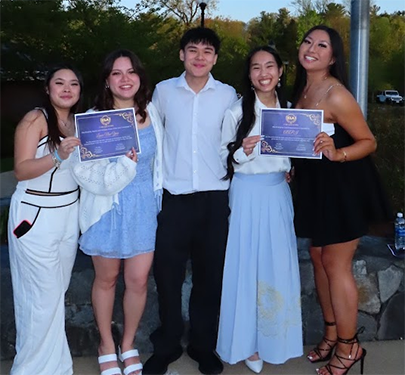 Asian American and Pacific Islander (AAPI) Club members pose for a photo at an event