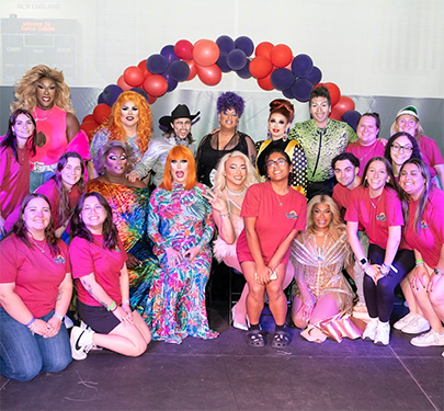 Queer Straight Alliance (QSA) members pose with Queens through the Decades