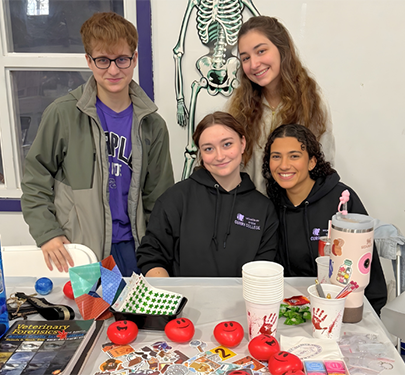 Forensic Science Club members display their work at a club event