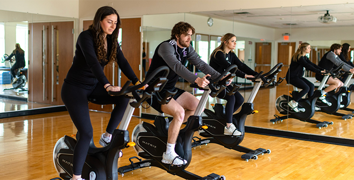 Students exercising during a fitness class in the Fitness Center