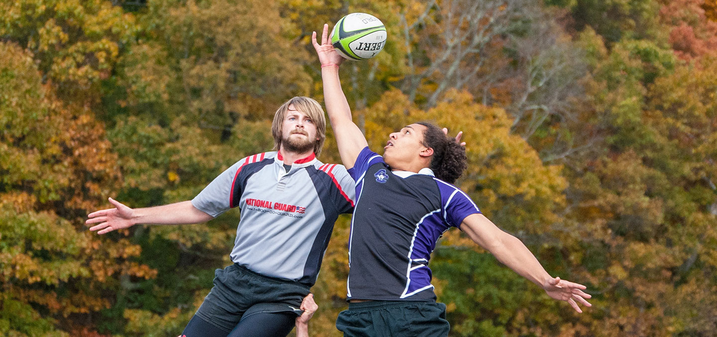 Rugby players jumping for the ball