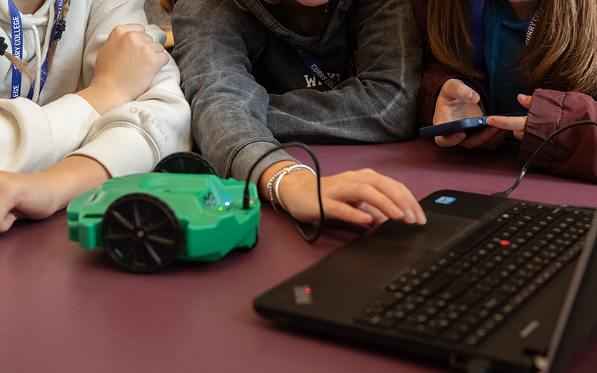High School students participate in a computer workshop at Curry College