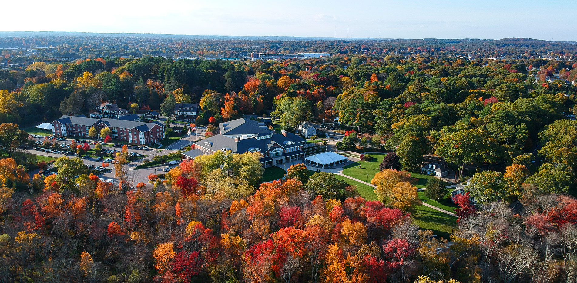 The Curry College campus is shown from above in autumn