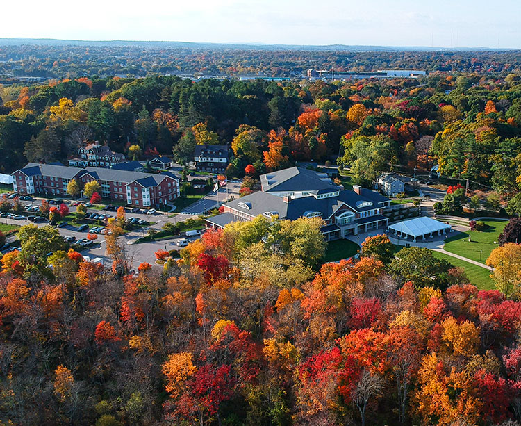 The Curry College campus is shown from above in autumn