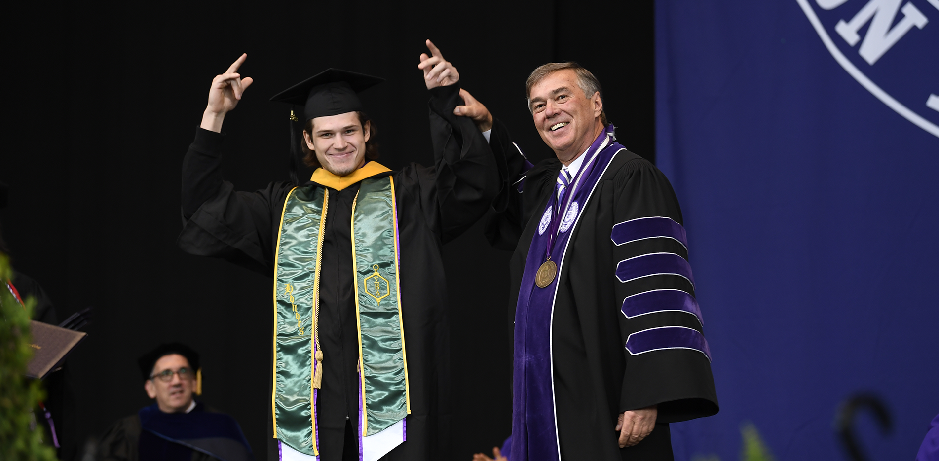 President Kenneth K. Quigley, Jr. and Mark Zhukov at the 2023 Curry College Commencement at Xfinity Center