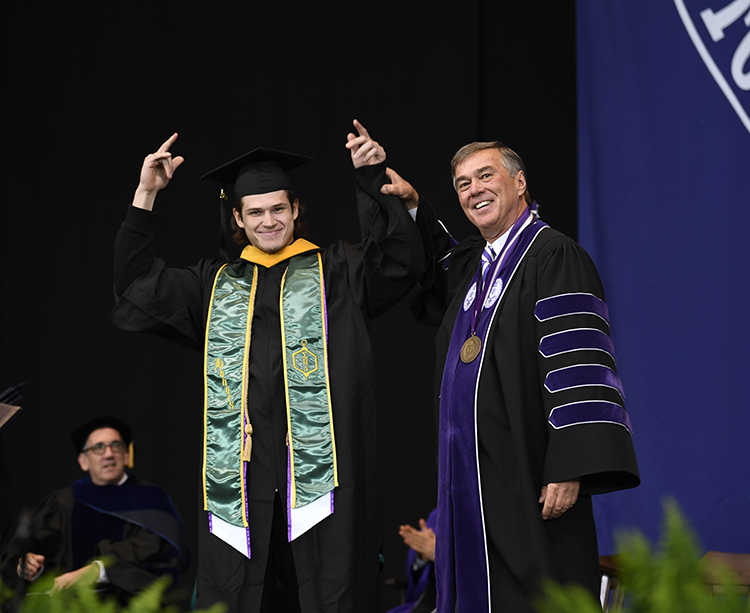 President Kenneth K. Quigley, Jr. and Mark Zhukov at the 2023 Curry College Commencement at Xfinity Center