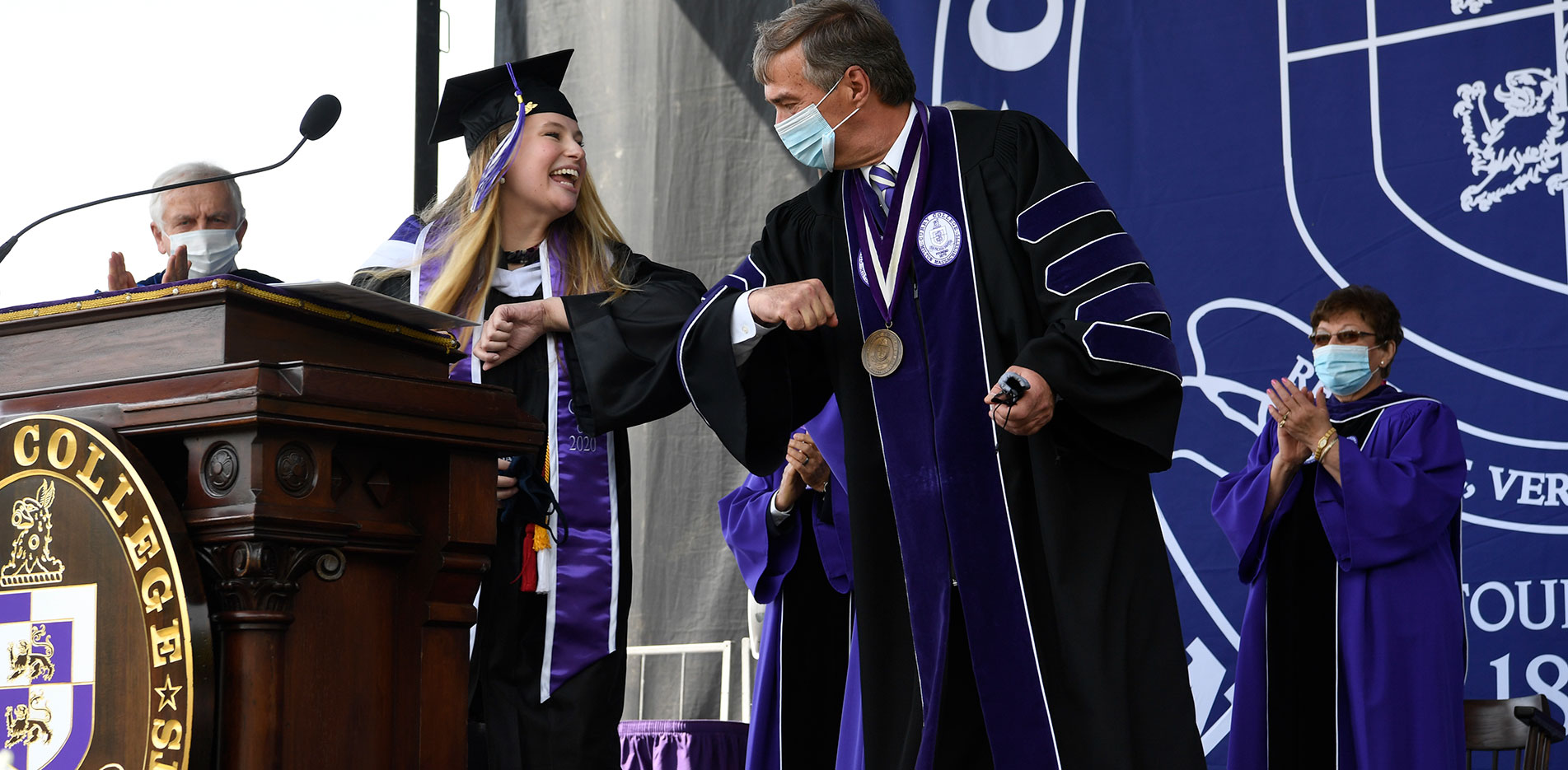 Curry Magazine Cover - Commencement 2021 Ceremony elbow bump