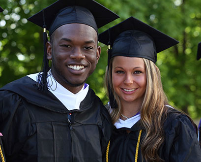 Curry College students pose for a Commencement photo