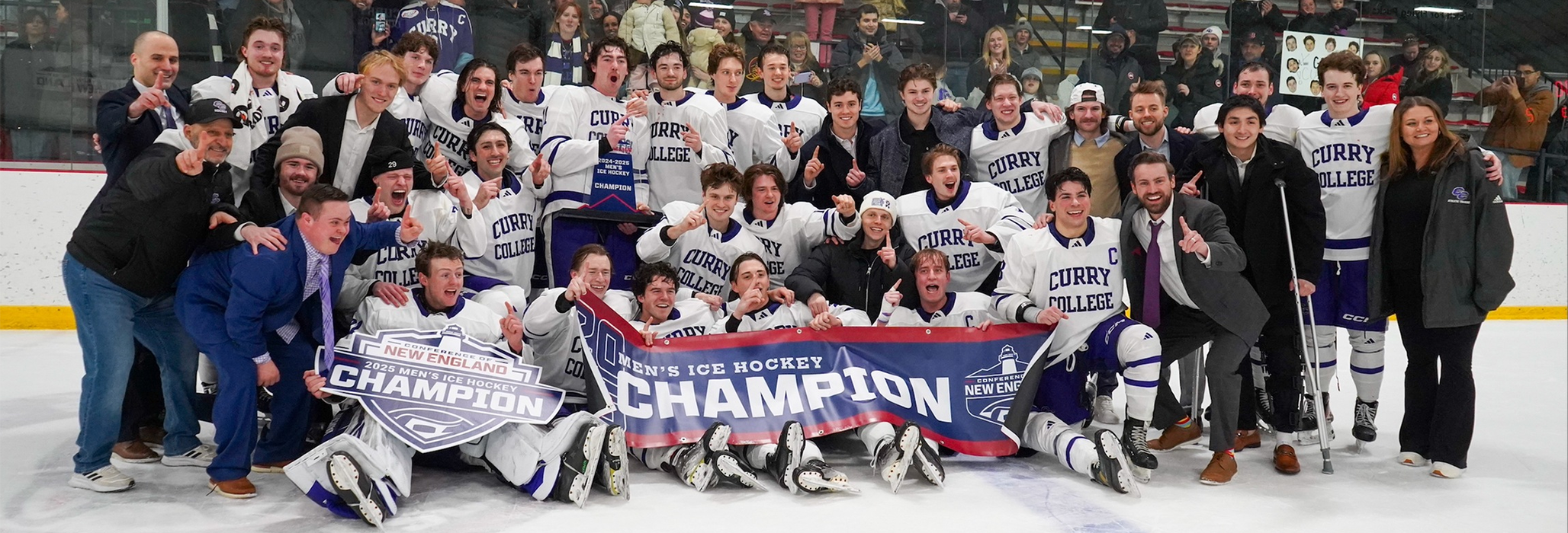Curry College Hockey Team poses for a picture on the Canton Ice House ice