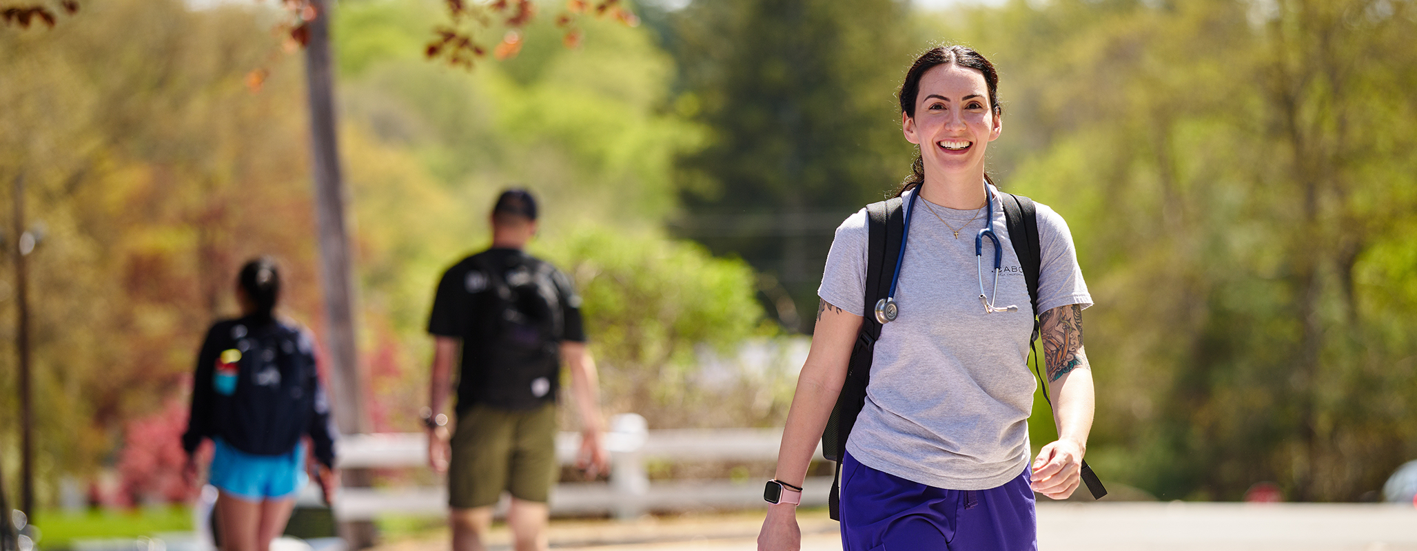 A Curry College nursing student walks to class